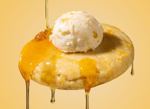 Crumbl Cornbread cookie on yellow background