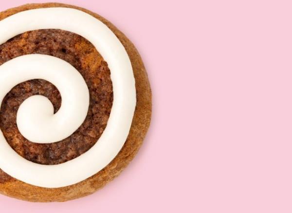 Pumpkin Pie Crumbl cookie on a pink background